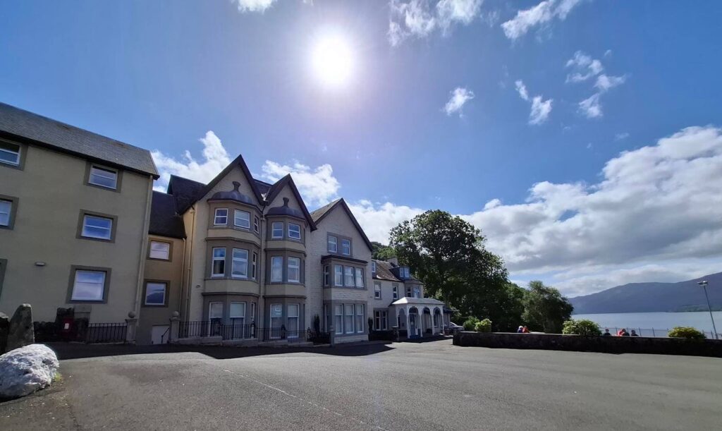 Inversnaid Hotel seen from the West Highland Way beside Loch Lomond