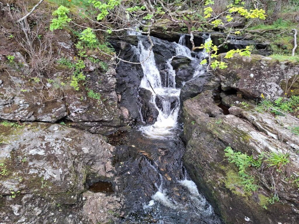 Approaching Inversnaid Hotel on the West Highland Way beside Loch Lomond