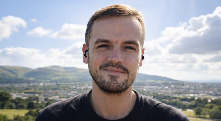 Peter Whyte outdoors with hills behind