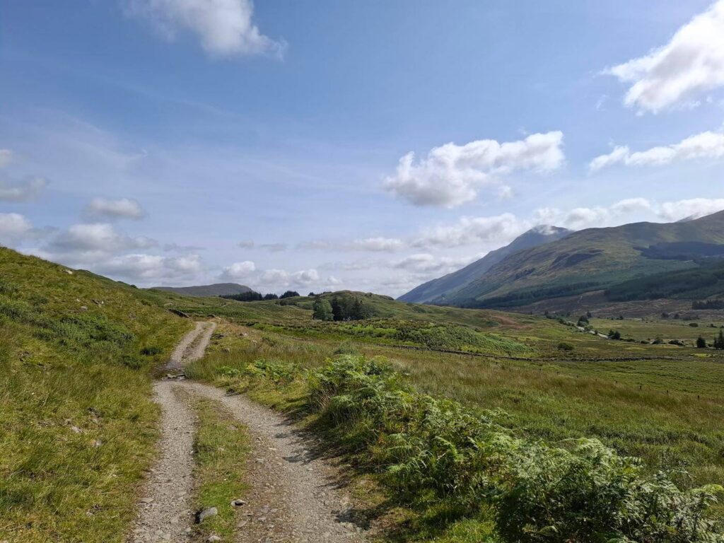 Path skirting a cleared hillside heading towards Ben Odhar