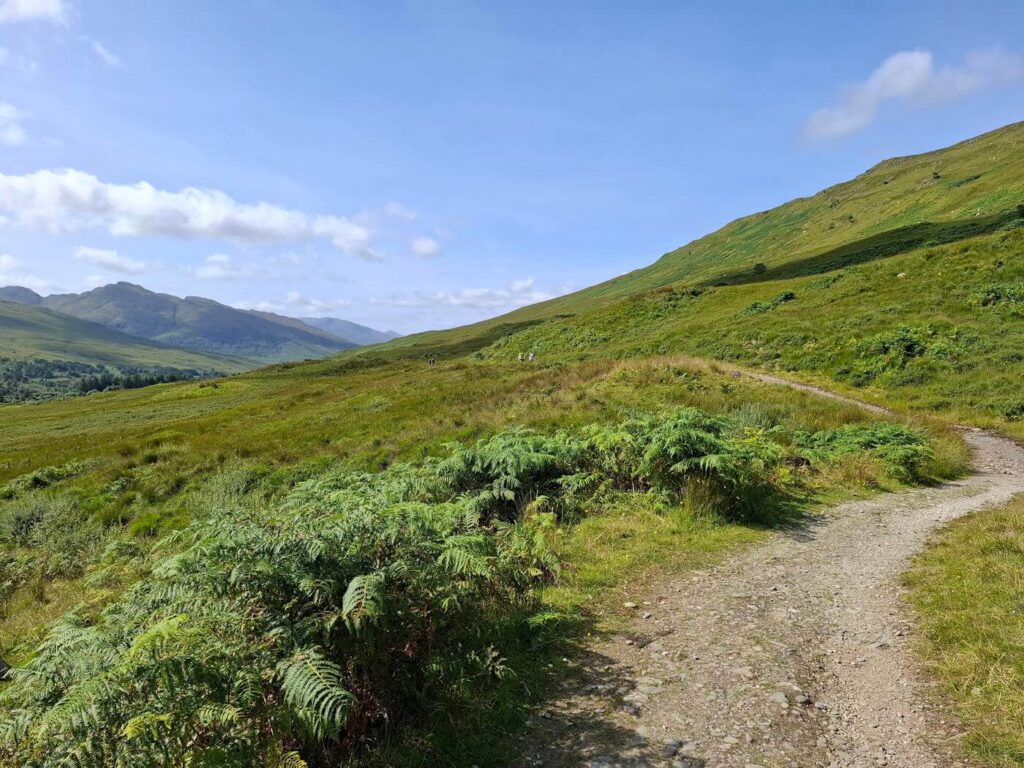 Open countryside trail scene along the West Highland Way