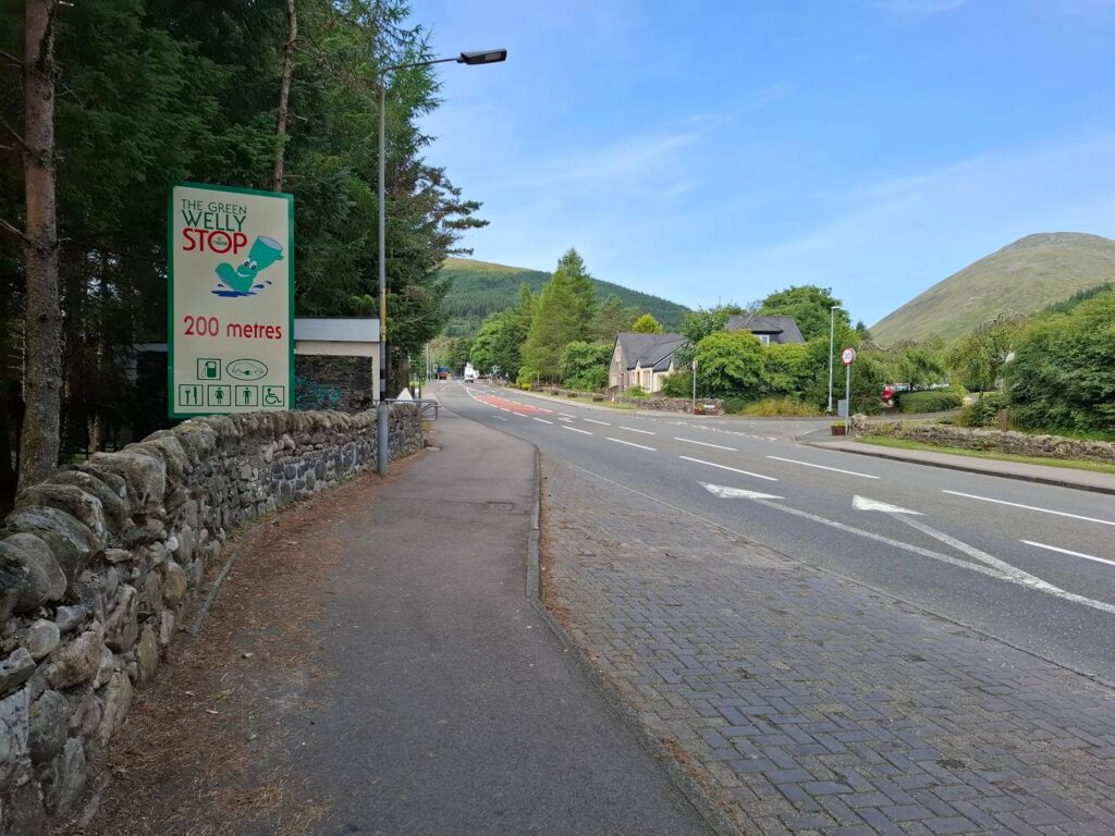 Road sign pointing to the Green Welly Stop at Tyndrum