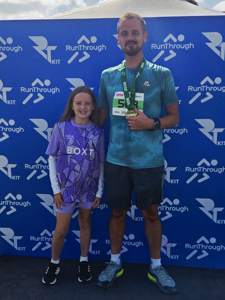 Peter Whyte and his daughter at the Edinburgh Running Festival, August 2026, Peter holding his medal